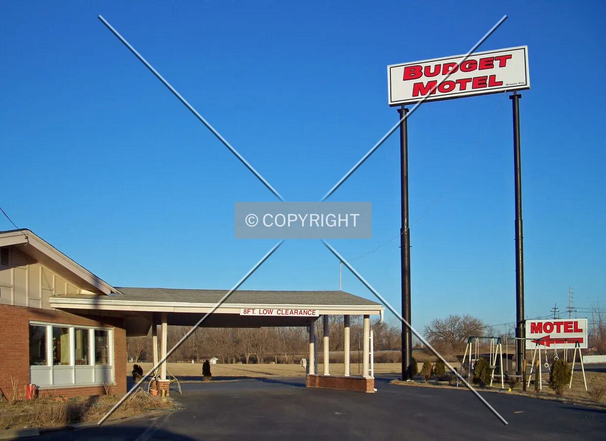 Sign and covered entrance from the southwest