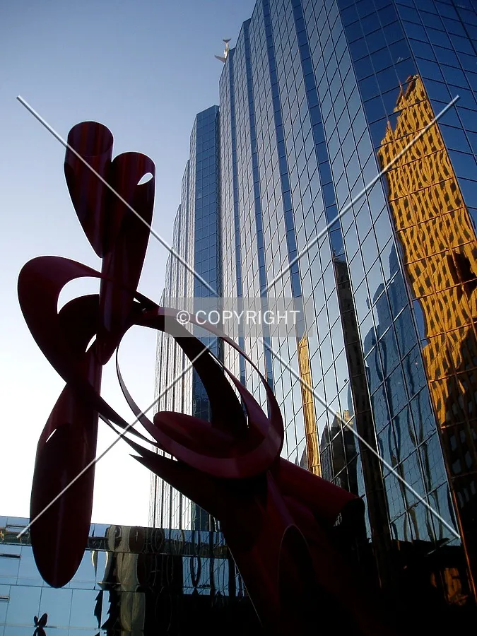 A sculpture in the plaza and the North Tower from the southeast