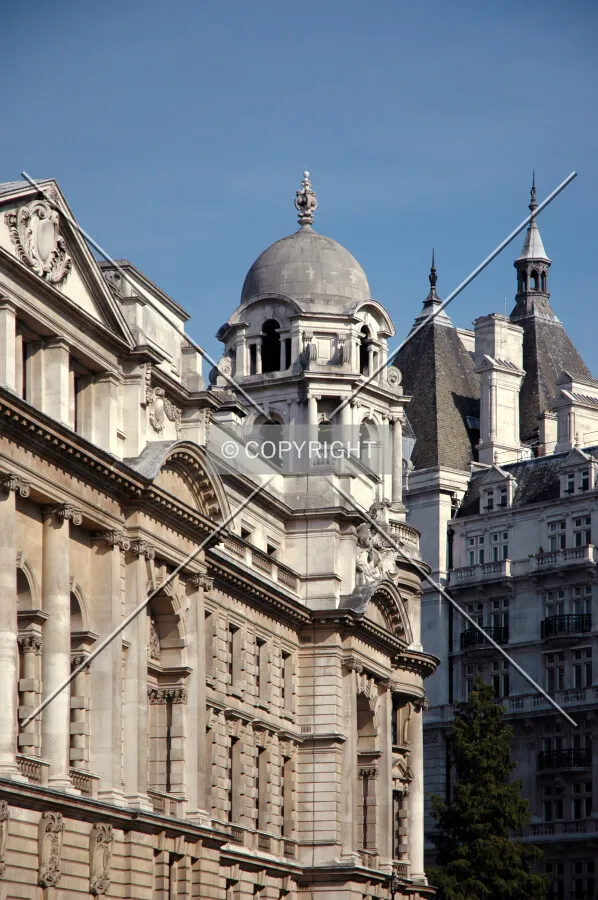The southeast corner tower alongside the pyramidal roof of Whitehall Court
