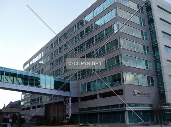 From the southeast on 16th Street, showing the catwalk to the main GlaxoSmithKline Building