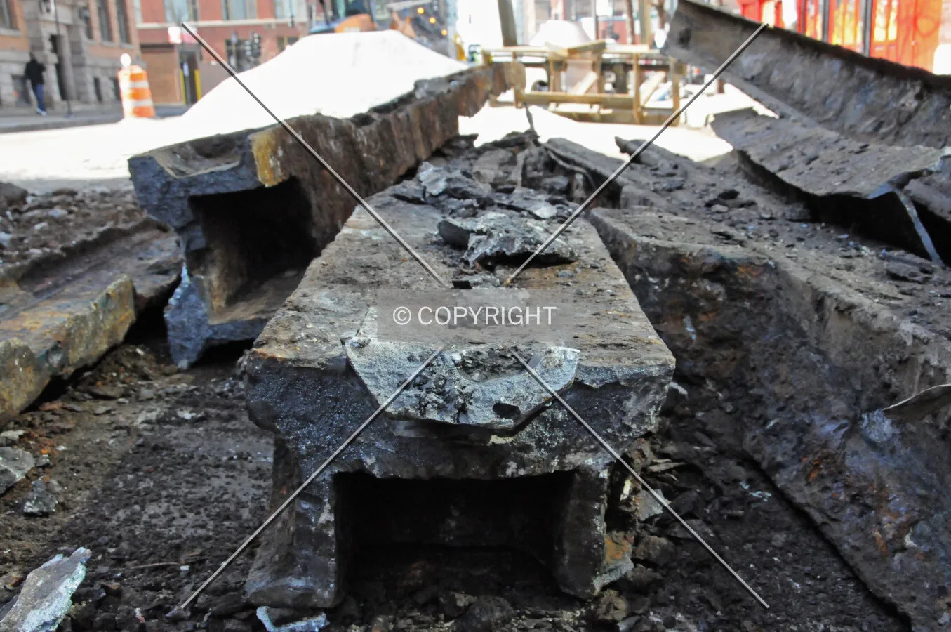 Former street railway pieces removed during the installation of new water pipes under Erie Street