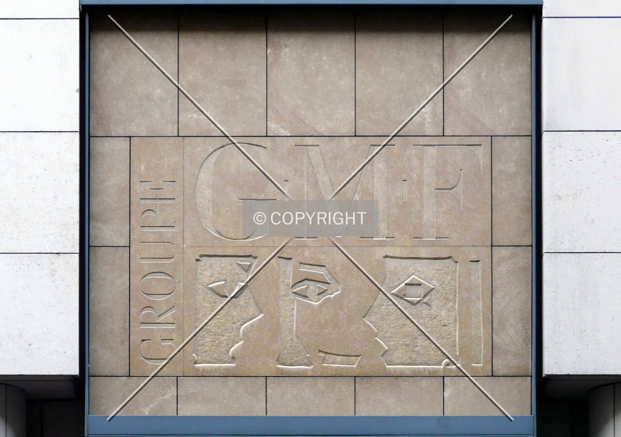 Tenant's logo carved into the wall above the entrance