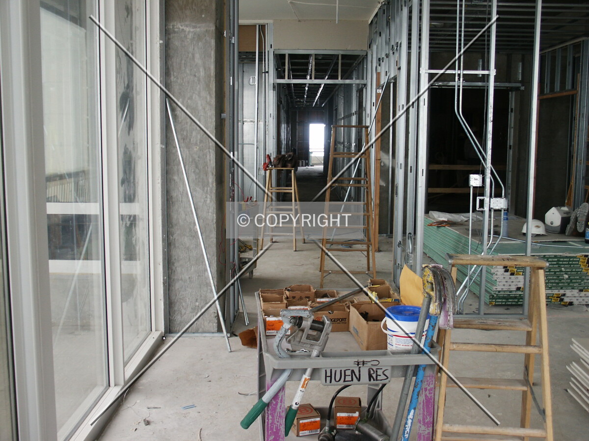 Corridor extending all the way through the building inside a south unit