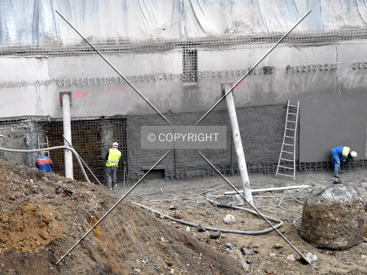 Retaining wall being built along Rue des Grands Moulins on the north side