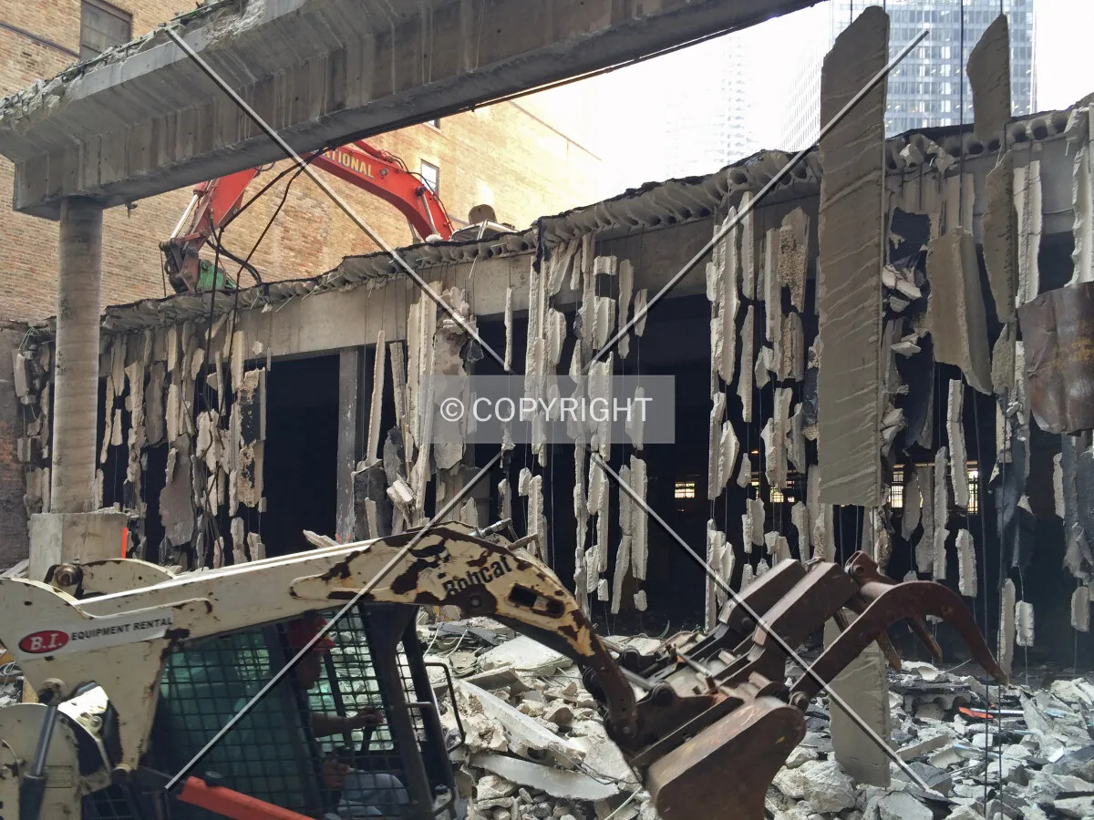 Looking west across the site from the rear alley during demolition. August 11, 2014.