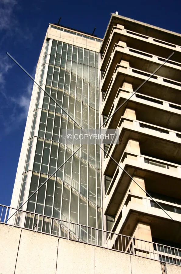 Looking up at an external glass stair tower