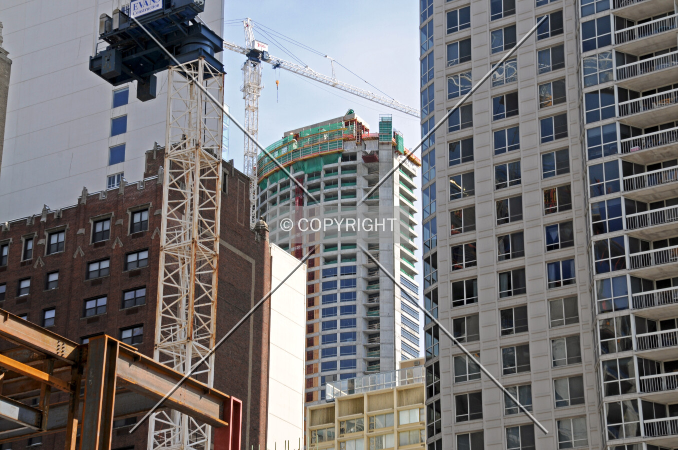 Looking southeast from the 900 Block of North State Street. The tower crane for 10 East Delaware is also visible in the foreground