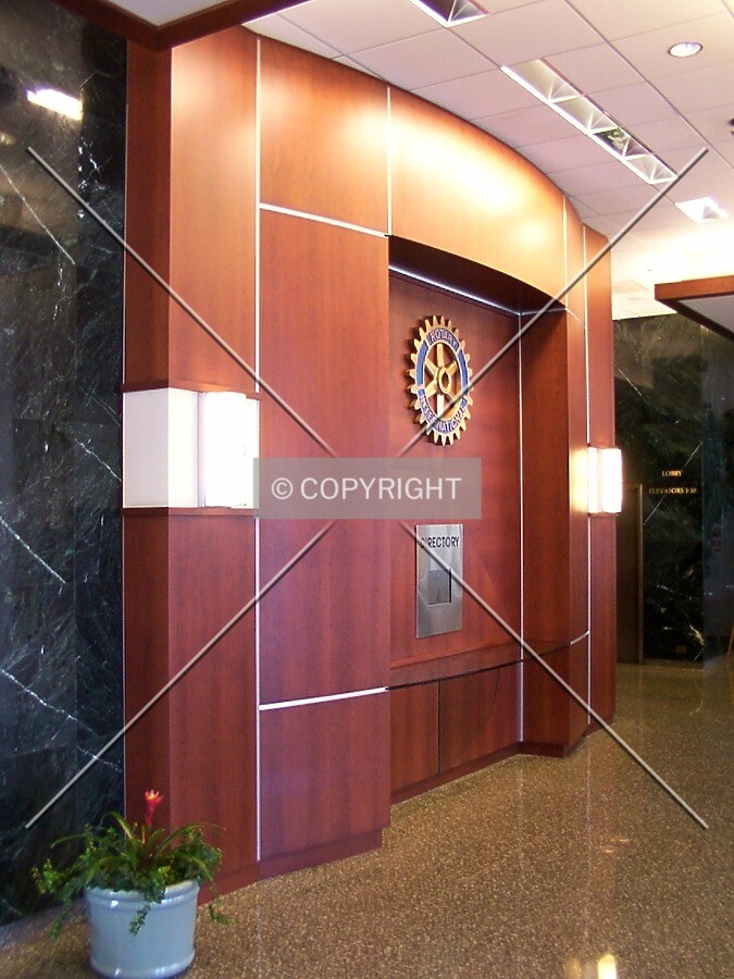 Lobby centerpiece with directory screen and Rotary Club seal