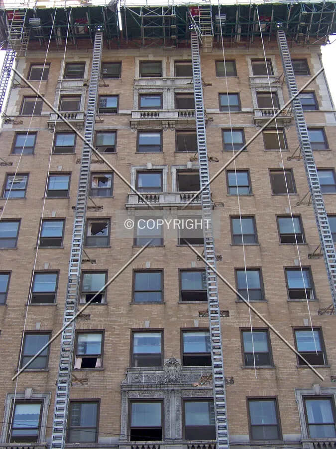 Looking up the north facade from Foster Avenue during the beginning stages of demolition