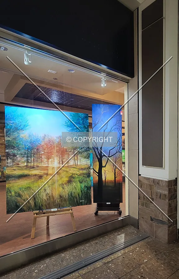 Art displayed in a storefront window; October 26, 2023