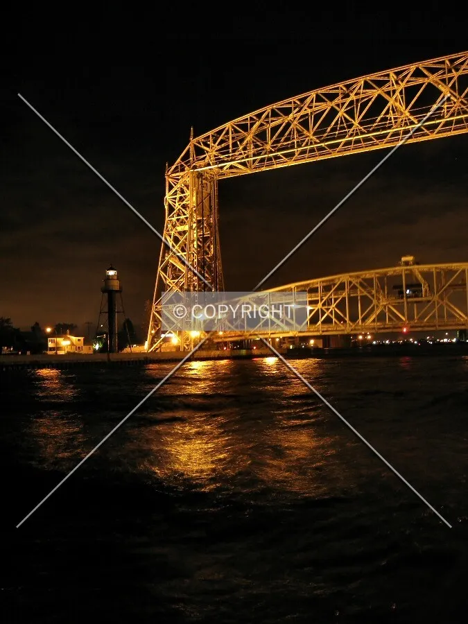 View to the southwest across the Duluth Ship Canal, the main span being lowered after allowing a pleasure boat pass