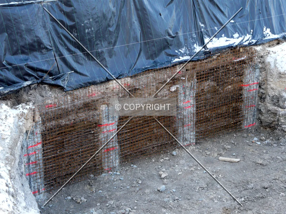 Retaining wall being built along Rue des Grands Moulins