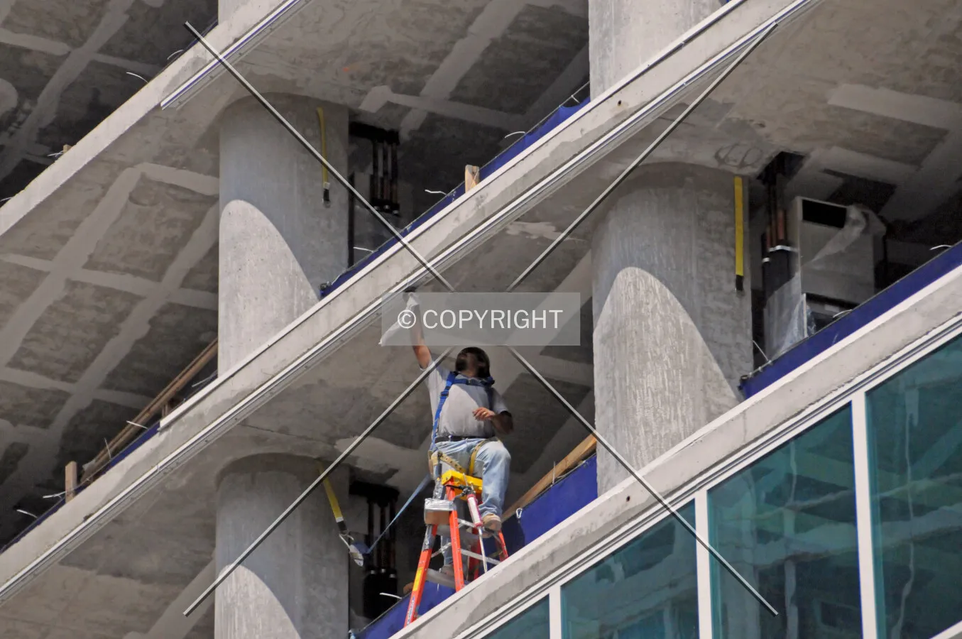 Worker adjusting the frame to hold the window glass in place