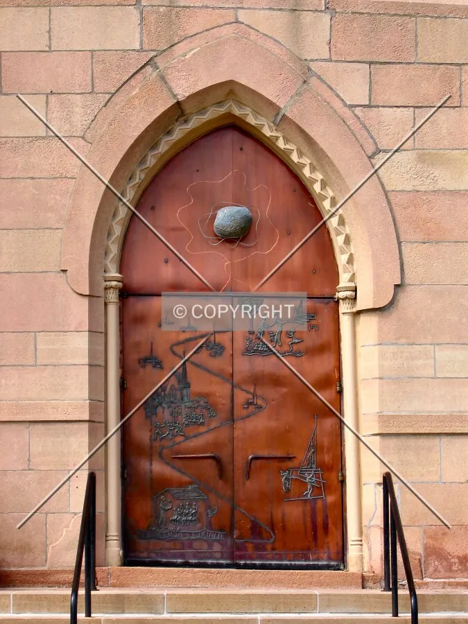 Main entrance along East 9th Street, settling with the years
