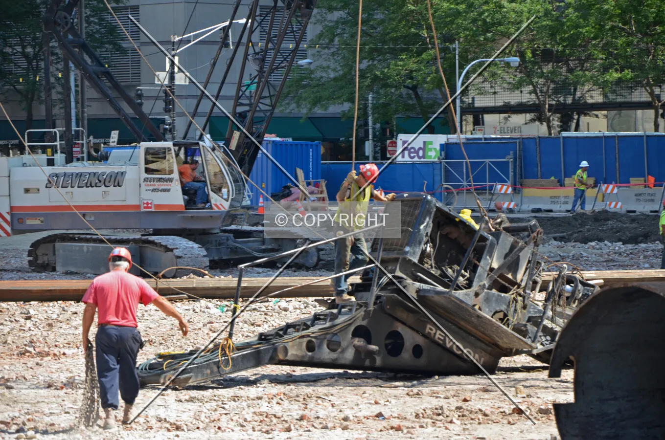 Workers assembling a caisson drill rig. August 24, 2013.