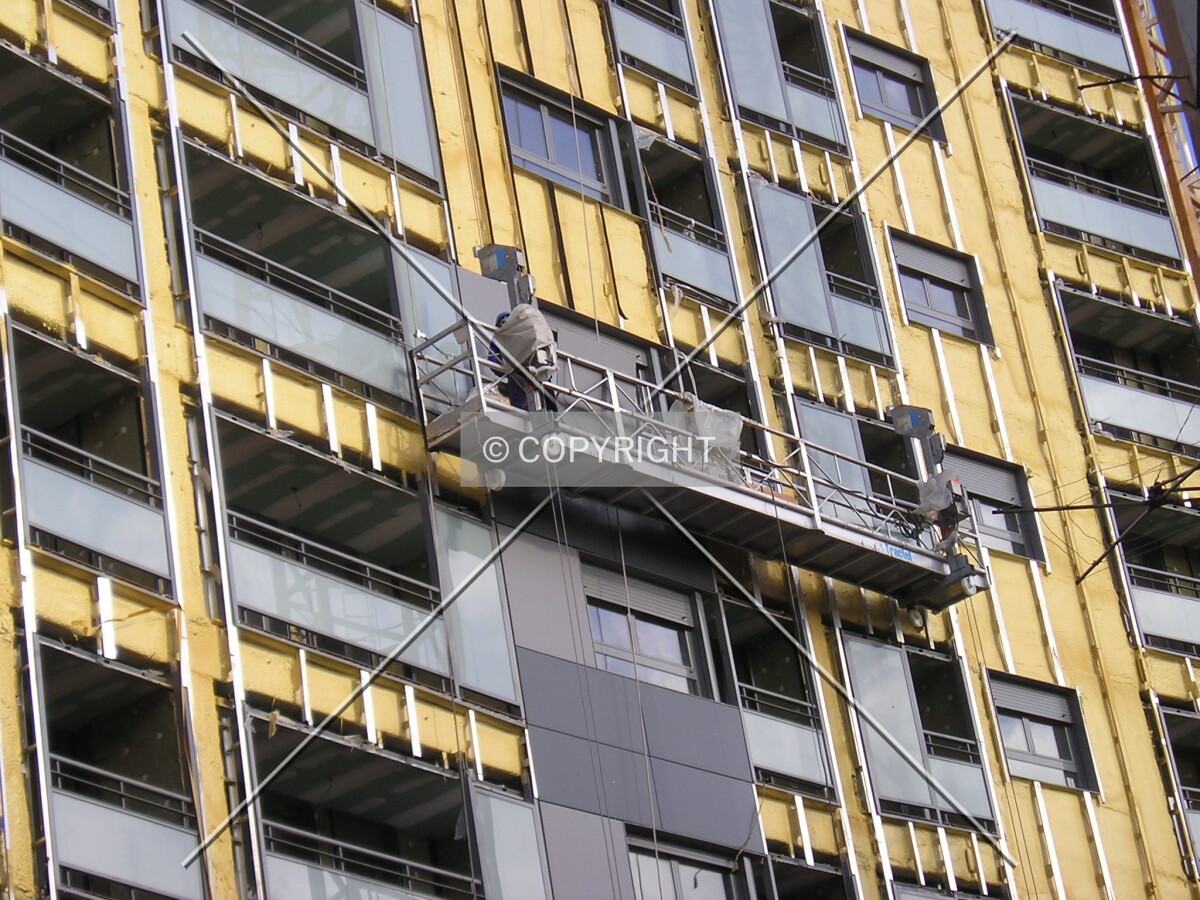 Some workers working on the facade