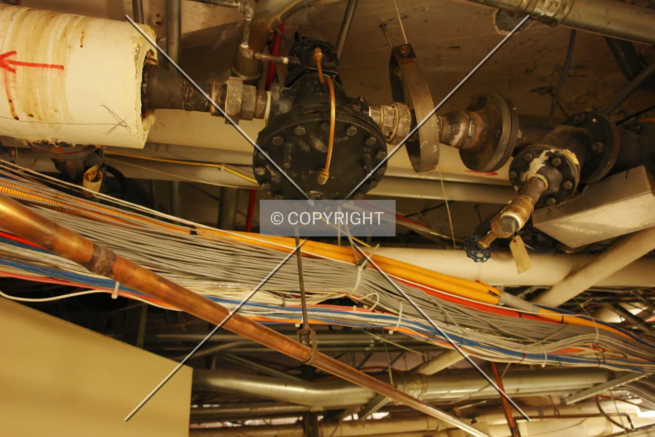 Cables in the ceiling of a corridor