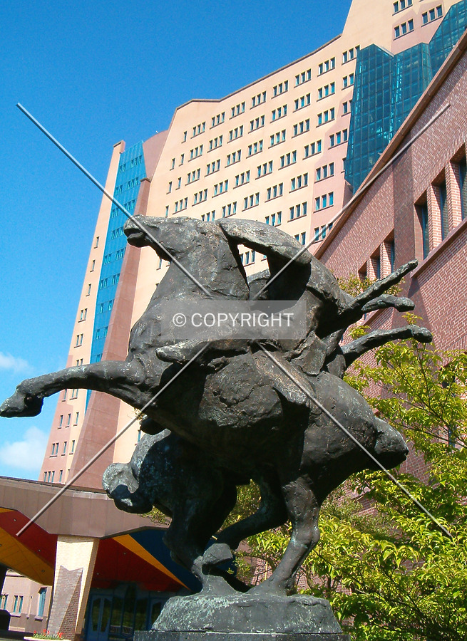 Statue of two horses in front of the building