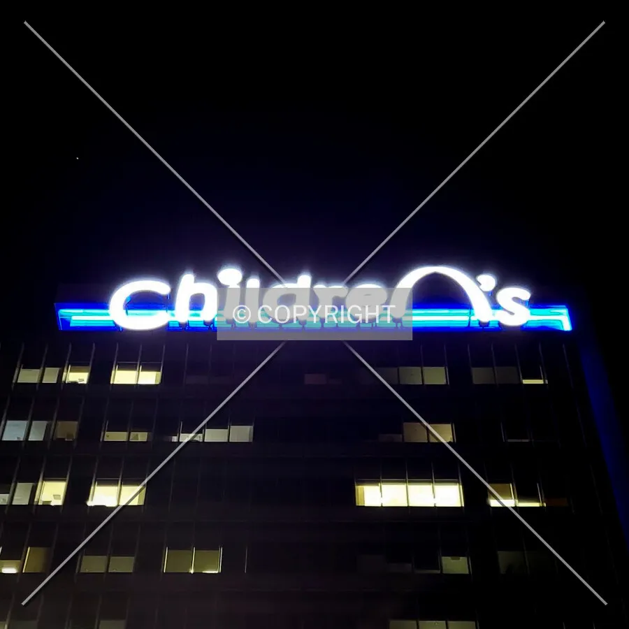Looking up at the sign at night; June 6, 2018