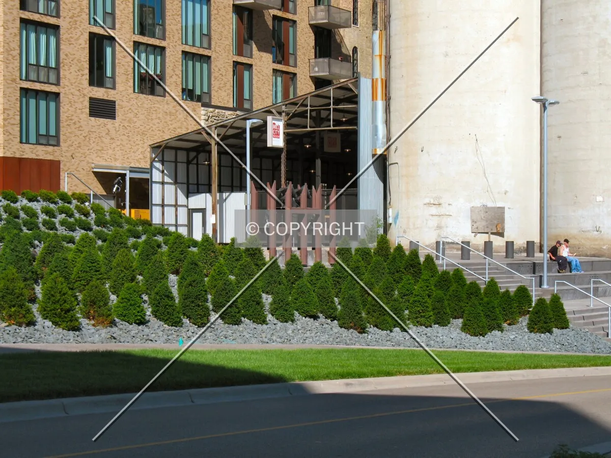 Landscaping and steps up to Chicago Plaza, from across West River Parkway