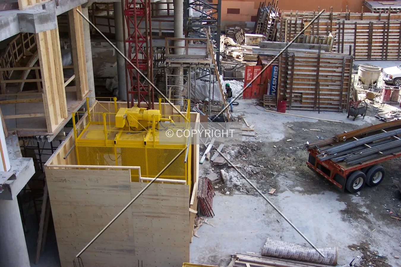 Looking down into the courtyard at the temporary exterior construction elevator