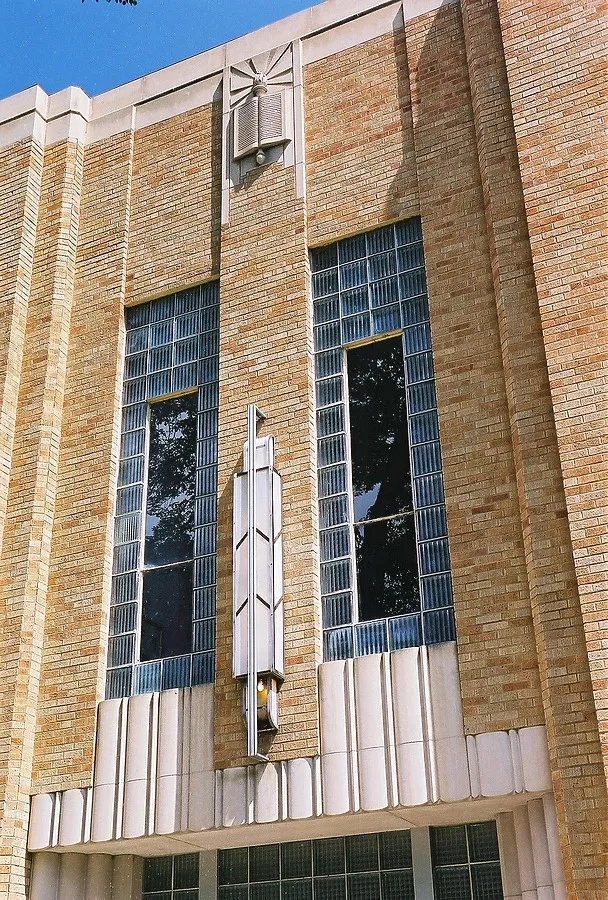 Light fixtures and windows above the entrance