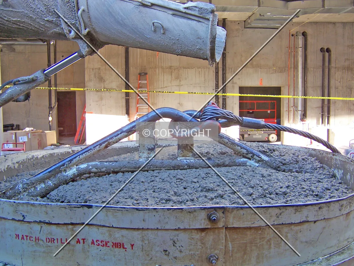 A freshly filled concrete bucket waiting to be hoisted upward