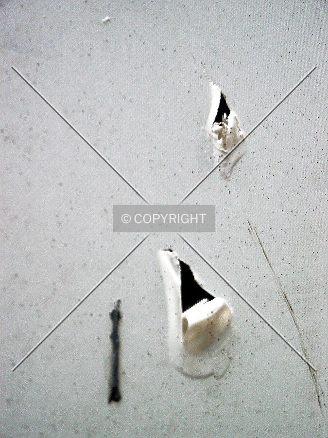White wrapping over the stainless steel facade