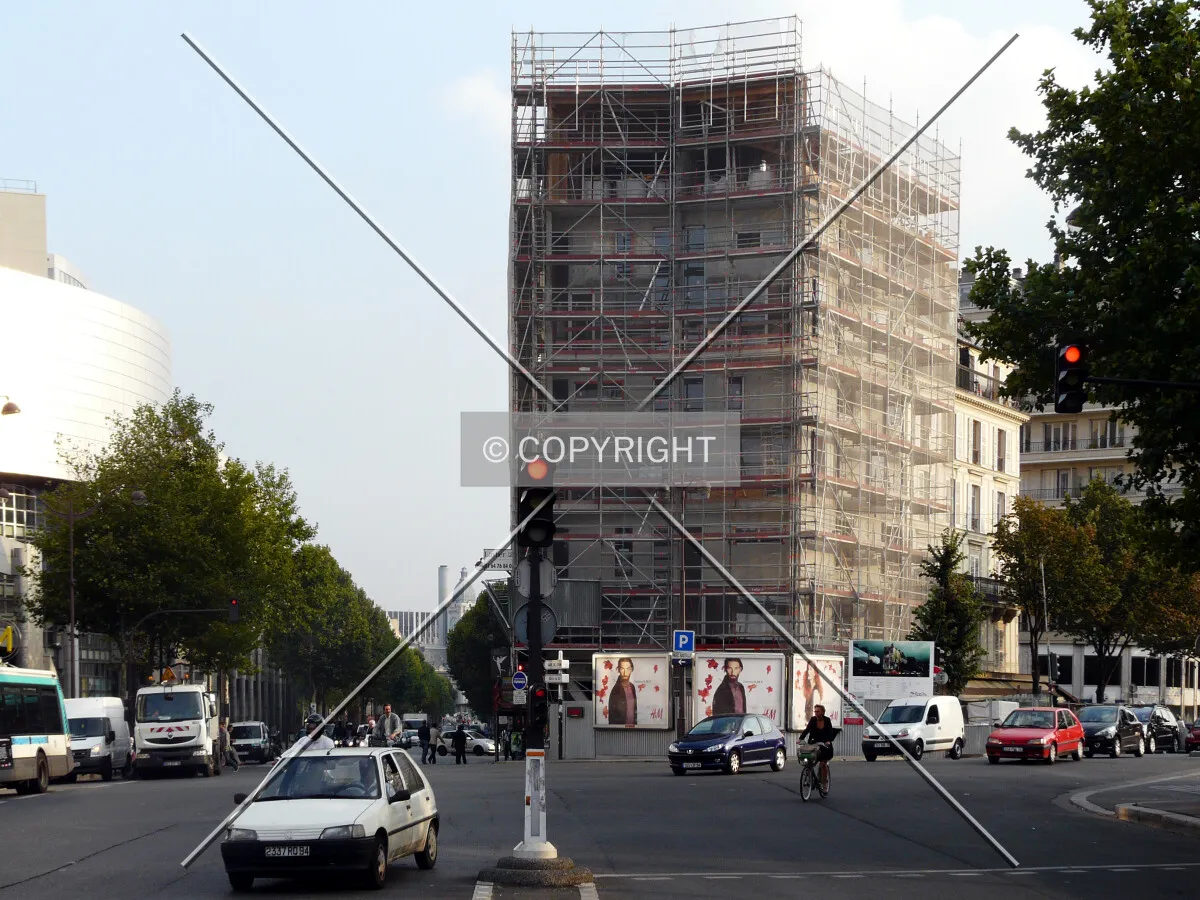 Scaffoldings wrapping the entire building, viewed from the north