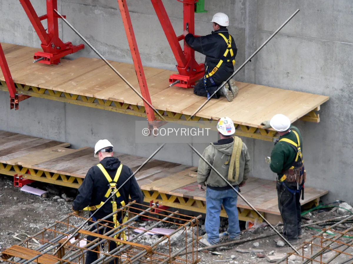 Construction workers working on formwork