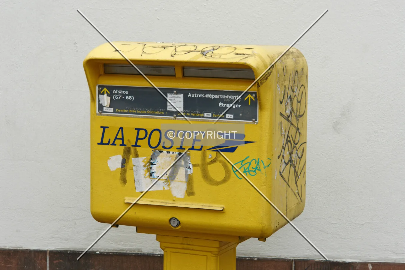 A yellow letter box from La Poste in France