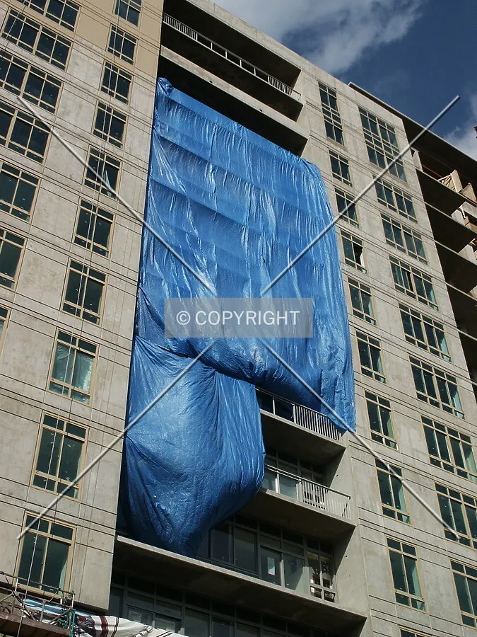 Tarpaulin over the central balconies