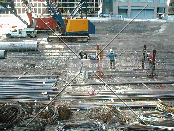 Construction workers perparing rebar for caissons