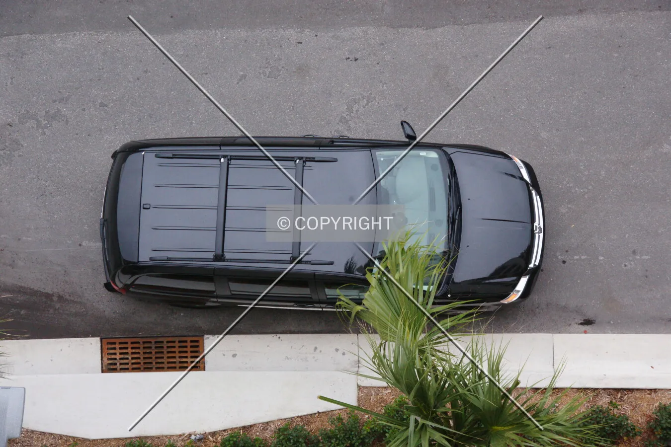 A black SUV as seen from above