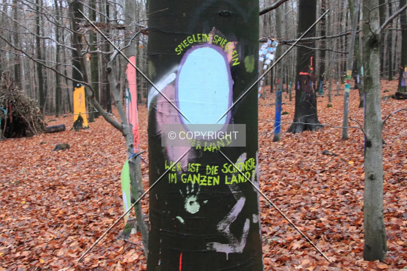 Painted tree trunk with the witch's mirror from Snow White