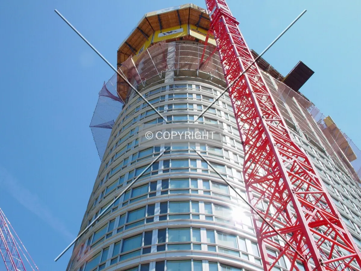 Looking up at the curvature of the tower