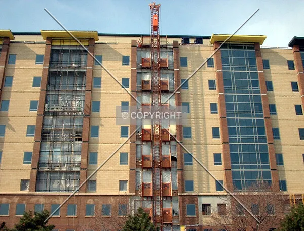 Hoist along 10th Avenue facade