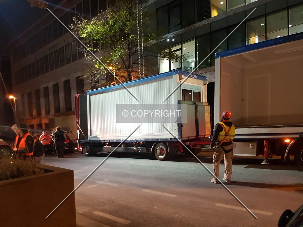 Containers are unloaded from a truck