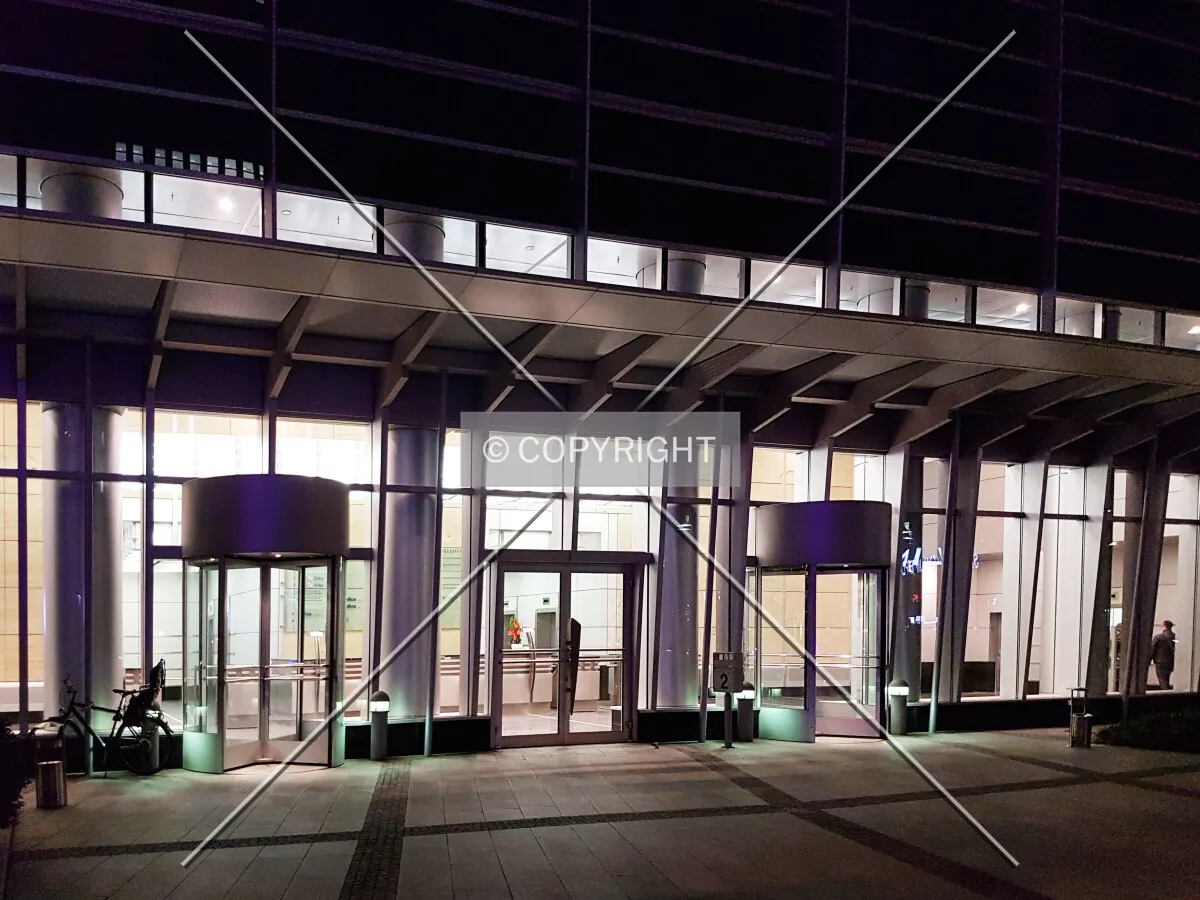 In front of the building at night time