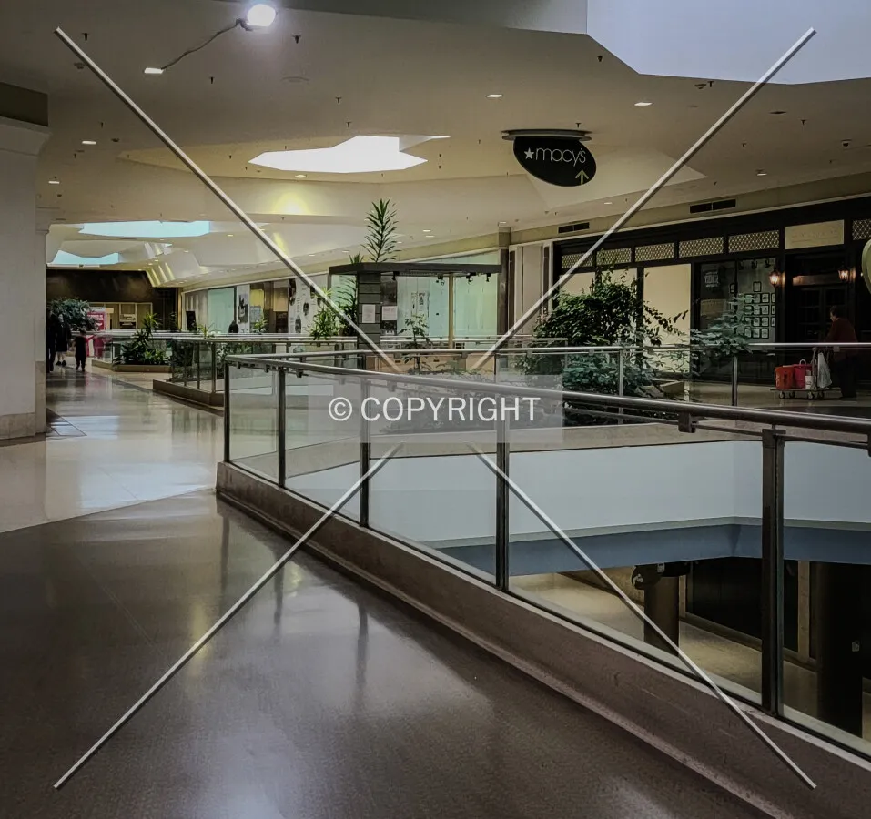 Second-floor hallway looking from the atrium towards the former Macy's Department Store; October 28, 2023