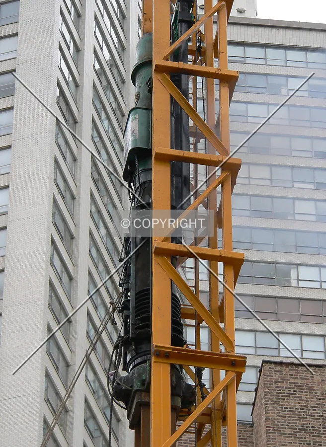 A pile driver hammer in action