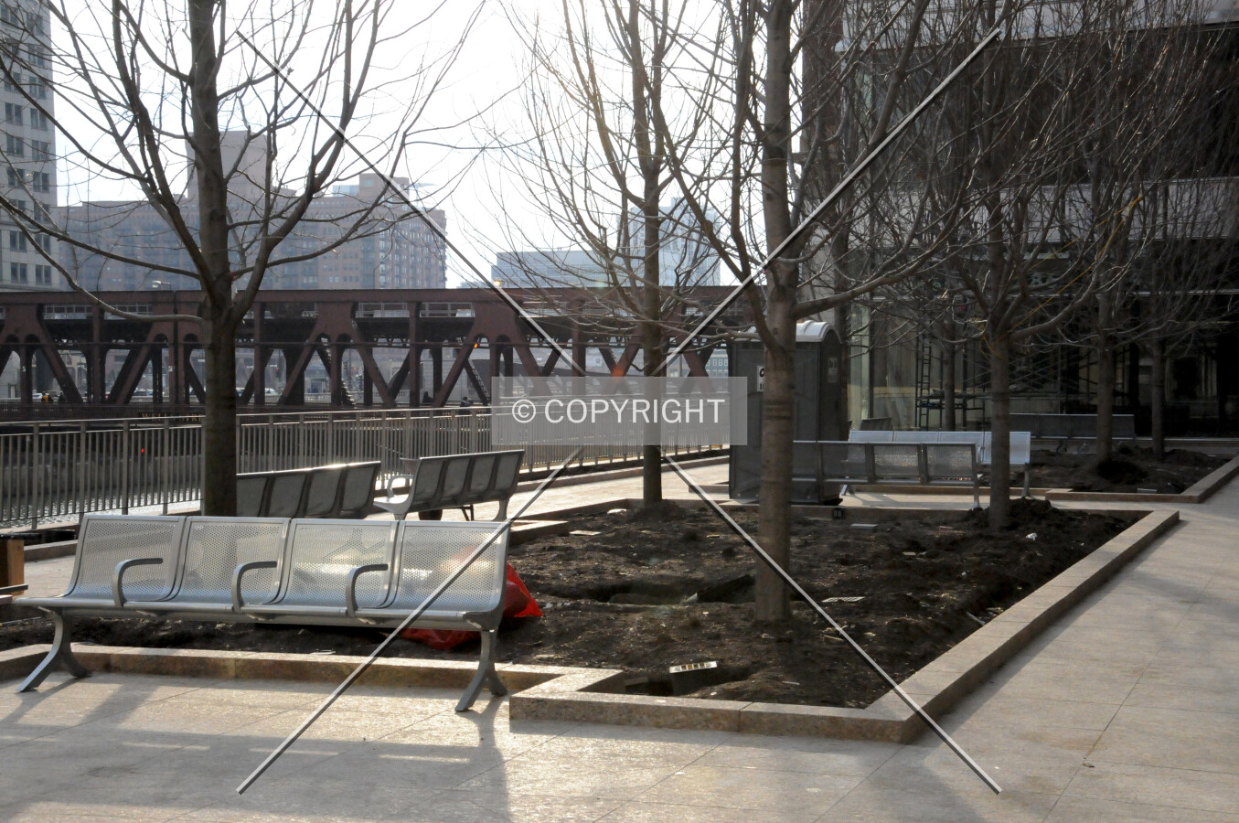Benches and planter areas on the upper level of the riverwalk