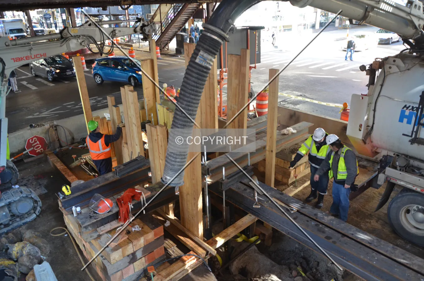 Workers performing utility work in Wabash Avenue in preparation for the station's demolition; March 7, 2015.