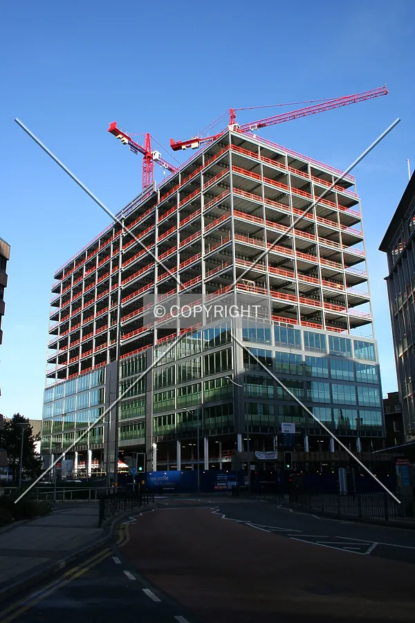 View from street level showing facade progress