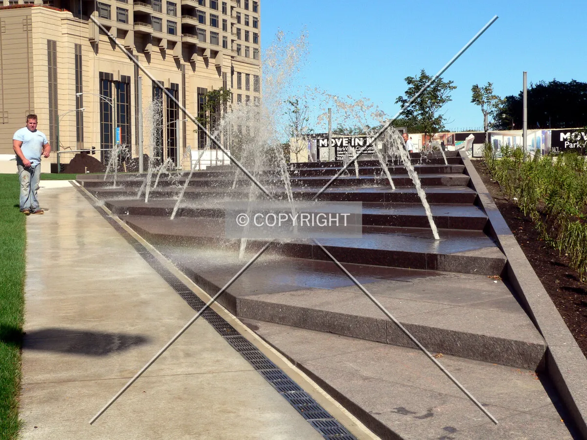 View to the northwest across the park as the fountain is tested