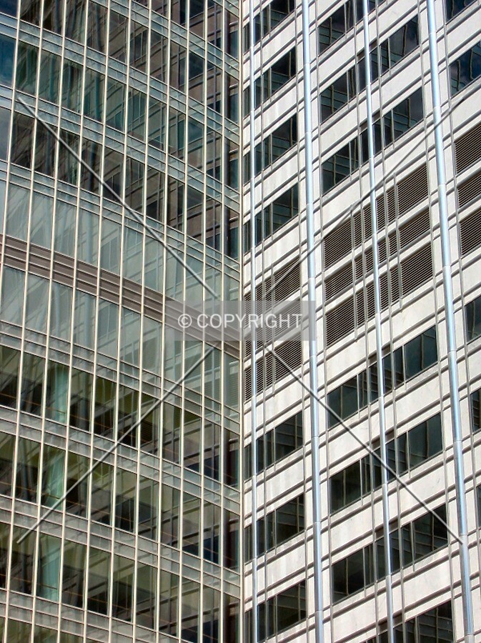 Undulating facade meets the linear facade from 2nd Avenue SW