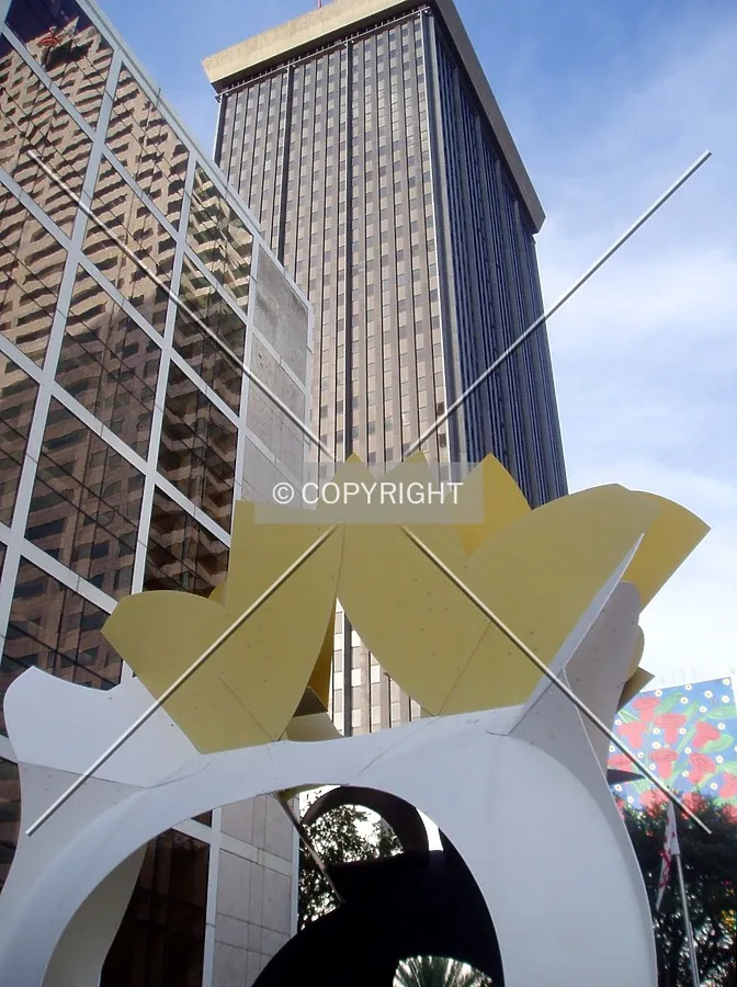 From the west over a sculpture near 400 North Ashley Plaza
