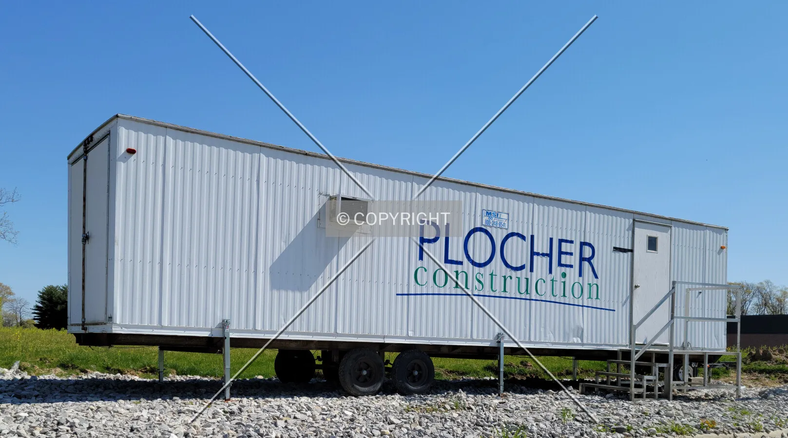 Plocher, Construction trailer on the corner of the construction site; April 22, 2021