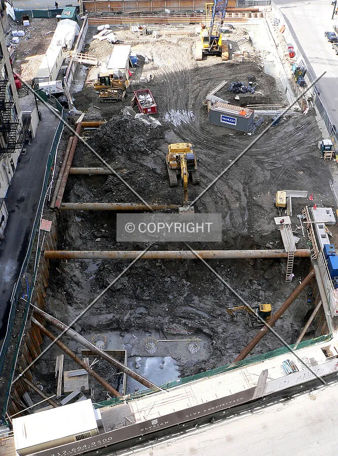 View of excavation along the eastern edge of the site with raker beams visible