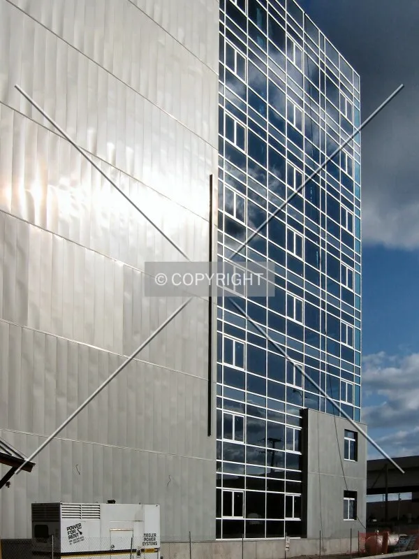 Sun glinting off the zinc facade